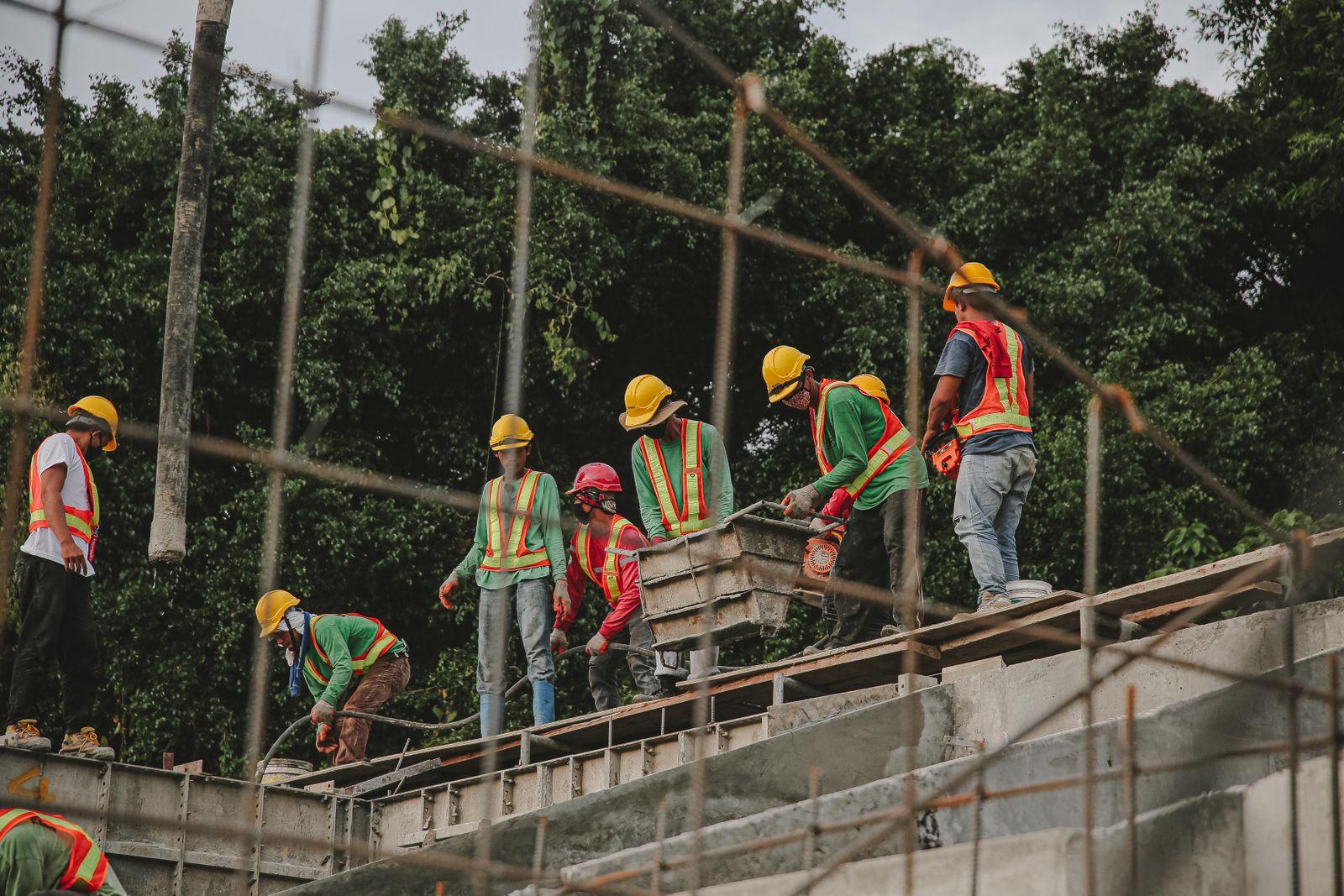 Group of workers wearing hard hats